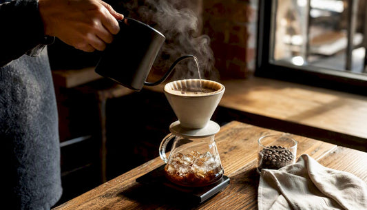 Pour-over iced coffee brewing over ice